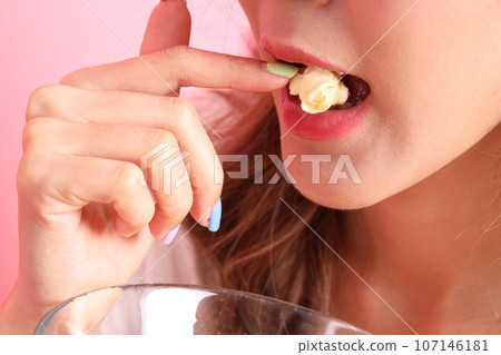 Hand with Dessert Hand with Dessert 107146181