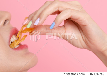 Eating Potato Chips Eating Potato Chips 107146782