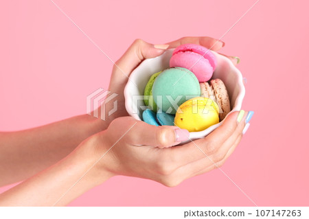 Hand with Macaroons 107147263