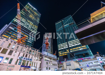Tokyo cityscape in Japan - View of Shibuya Station, Shibuya Station demolition work, cranes, skyscrapers, etc. (night view) 107147484