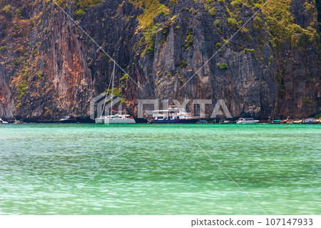 The legendary Maya Bay beach without people where the film "beach" with Leonardo DiCaprio was filmed with a beautiful bay of sand and clear turquoise water. UNESCO World Heritage. 107147933