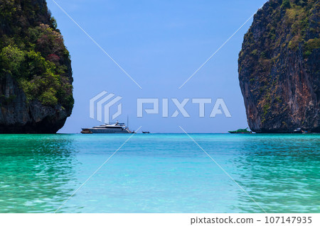 The legendary Maya Bay beach without people where the film "beach" with Leonardo DiCaprio was filmed with a beautiful bay of sand and clear turquoise water. UNESCO World Heritage. 107147935