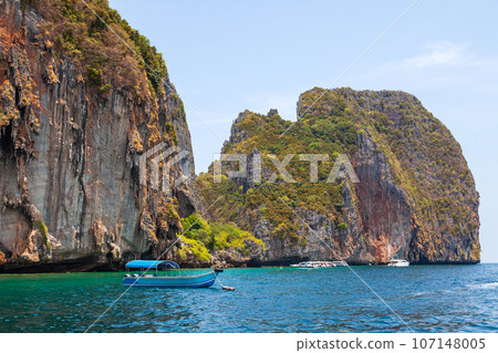 island phi phi leh and boat in thailand andaman sea. travel during vacation to the hot countries of asia. 107148005