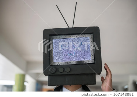 Man with TV smiling face instead of head Man with TV smiling face instead of head 107148091