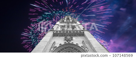 Celebratory fireworks over the Great gothic church of Saint Germain l Auxerrois, Paris, France Celebratory fireworks over the Great gothic church of Saint Germain l Auxerrois, Paris, France 107148569