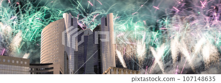 Celebratory fireworks over the Skyscrapers La Defense, commercial and business center of Paris, France Celebratory fireworks over the Skyscrapers La Defense, commercial and business center of Paris, France 107148635