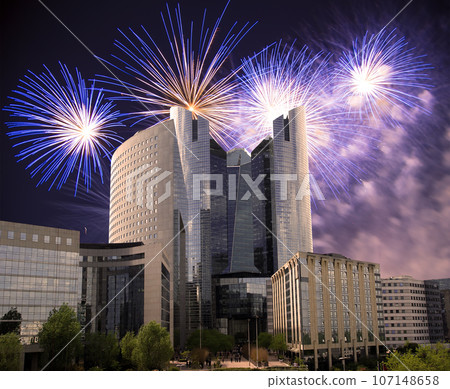 Celebratory fireworks over the Skyscrapers La Defense, commercial and business center of Paris, France Celebratory fireworks over the Skyscrapers La Defense, commercial and business center of Paris, France 107148658