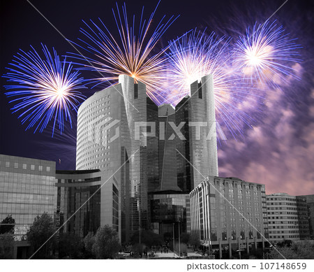 Celebratory fireworks over the Skyscrapers La Defense, commercial and business center of Paris, France Celebratory fireworks over the Skyscrapers La Defense, commercial and business center of Paris, France 107148659