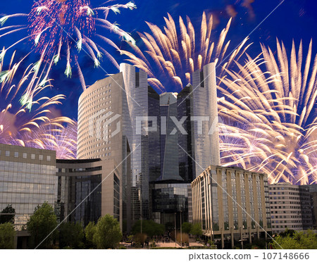 Celebratory fireworks over the Skyscrapers La Defense, commercial and business center of Paris, France 107148666