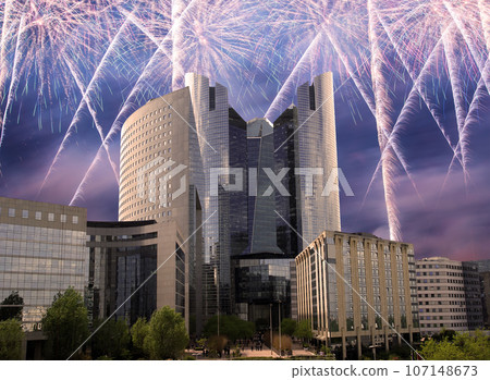 Celebratory fireworks over the Skyscrapers La Defense, commercial and business center of Paris, France Celebratory fireworks over the Skyscrapers La Defense, commercial and business center of Paris, France 107148673