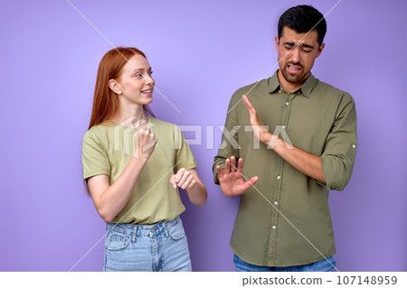 beautiful young red-haired woman asking man to work beautiful young red-haired woman asking man to work 107148959