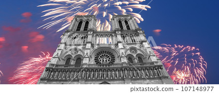 Celebratory fireworks over the Notre Dame de Paris, also known as Notre Dame Cathedral or simply Notre Dame, is a Gothic, Roman Catholic cathedral of Paris, France Celebratory fireworks over the Notre Dame de Paris, also known as Notre Dame Cathedral or simply Notre Dame, is a Gothic, Roman Catholic cathedral of Paris, France 107148977