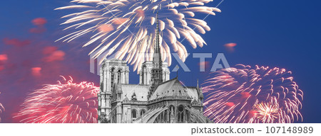 Celebratory fireworks over the Notre Dame de Paris, also known as Notre Dame Cathedral or simply Notre Dame, is a Gothic, Roman Catholic cathedral of Paris, France 107148989