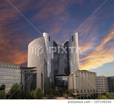 Skyscrapers La Defense (against the background of a sky at sunset), commercial and business center of Paris, France 107149204