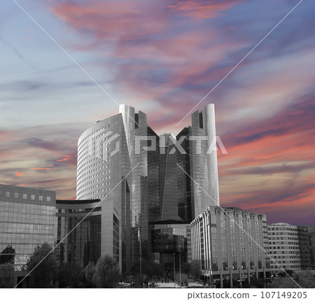 Skyscrapers La Defense (against the background of a sky at sunset), commercial and business center of Paris, France 107149205
