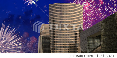 Celebratory fireworks over the Skyscrapers La Defense, commercial and business center of Paris, France Celebratory fireworks over the Skyscrapers La Defense, commercial and business center of Paris, France 107149483