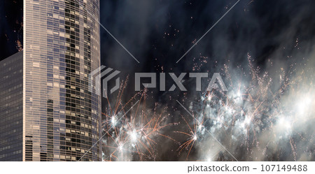 Celebratory fireworks over the Skyscrapers La Defense, commercial and business center of Paris, France 107149488