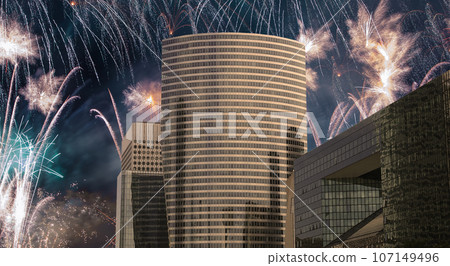 Celebratory fireworks over the Skyscrapers La Defense, commercial and business center of Paris, France Celebratory fireworks over the Skyscrapers La Defense, commercial and business center of Paris, France 107149496
