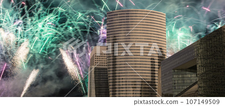 Celebratory fireworks over the Skyscrapers La Defense, commercial and business center of Paris, France Celebratory fireworks over the Skyscrapers La Defense, commercial and business center of Paris, France 107149509