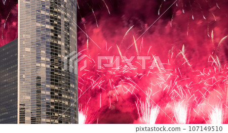 Celebratory fireworks over the Skyscrapers La Defense, commercial and business center of Paris, France 107149510