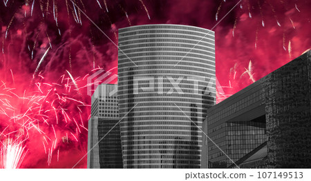 Celebratory fireworks over the Skyscrapers La Defense, commercial and business center of Paris, France 107149513