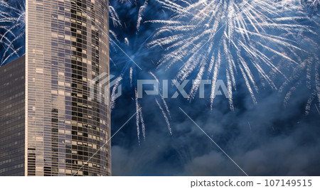 Celebratory fireworks over the Skyscrapers La Defense, commercial and business center of Paris, France Celebratory fireworks over the Skyscrapers La Defense, commercial and business center of Paris, France 107149515