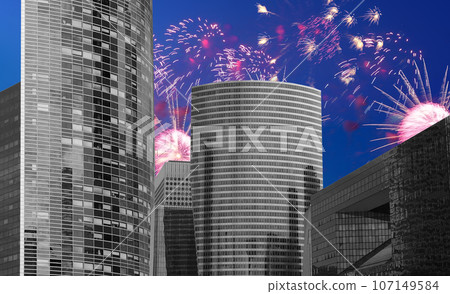 Celebratory fireworks over the Skyscrapers La Defense, commercial and business center of Paris, France 107149584