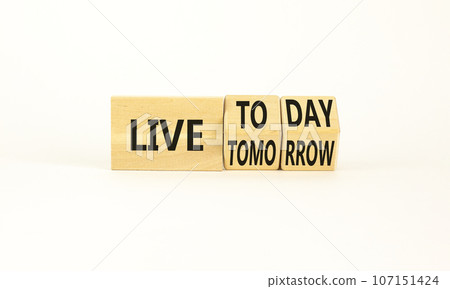 Live today not tomorrow symbol. Businessman turns wooden cubes and changes word Live tomorrow to Live today. Beautiful white background. Business and live today not tomorrow concept. Copy space. 107151424