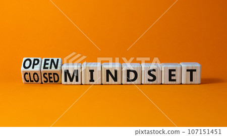Open or closed mindset symbol. Turned wooden cubes and changed concept words closed mindset to open mindset. Beautiful orange background, copy space. Business open or closed mindset concept. Open or closed mindset symbol. Turned wooden cubes and changed concept words closed mindset to open mindset. Beautiful orange background, copy space. Business open or closed mindset concept. 107151451