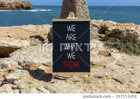 We are what we think symbol. Concept word We are what we think on beautiful black chalkboard. Beautiful stone sea background. Business We are what we think concept. Copy space. 107151458