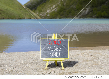 Good vibes only symbol. Concept word Good vibes only on beautiful black chalk blackboard. Beautiful mountain lake sand beach background. Business motivational good vibes only concept. Copy space. 107151466