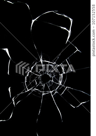 Abstract cracked texture of broken glass on a black background. 107152558