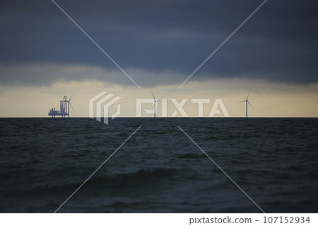 Station for installing a wind generator at sea. Evening in Denmark Station for installing a wind generator at sea. Evening in Denmark 107152934