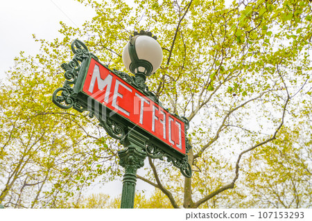 Red metro sign on the traditional green street lamp, Paris, France Red metro sign on the traditional green street lamp, Paris, France 107153293