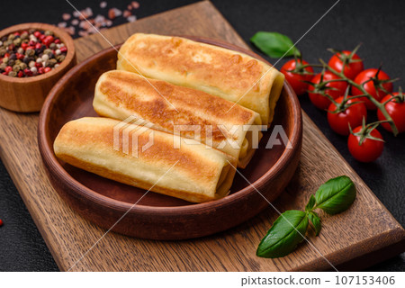 Delicious fresh homemade fried pancakes with broccoli and meat or fish 107153406