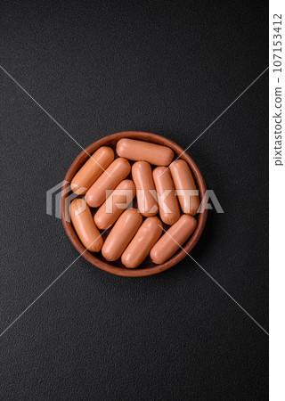 Delicious fresh vegetarian sausage or sausage made from vegetable protein tofu or seitan 107153412