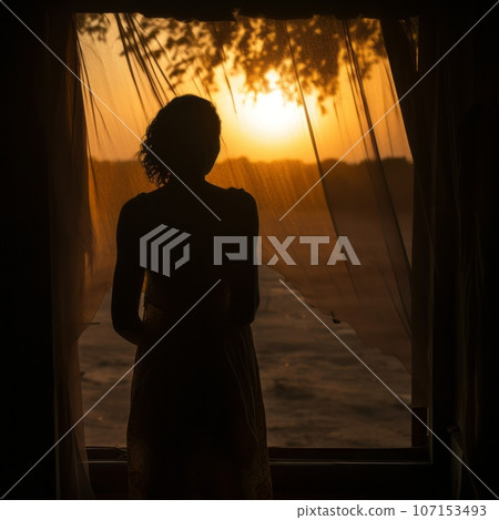 Blurred silhouette of a woman seen through a dusty window at sunset 107153493