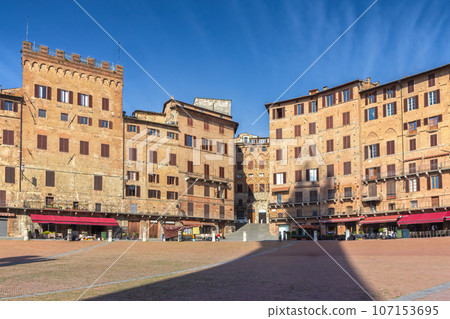 Famous empty Square (Piazza del Campo) in Siena, Tuscany Italy. Famous empty Square (Piazza del Campo) in Siena, Tuscany Italy. 107153695