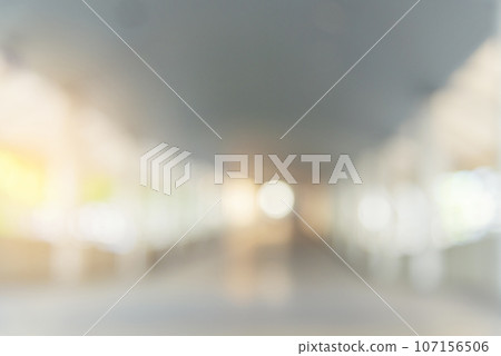 Blurred background hospital healthcare white bokeh with copy space. Blue clean bright blurry background medical laboratory backdrop. Interior lobby simple living space light bokeh. Blurry hallway 107156506
