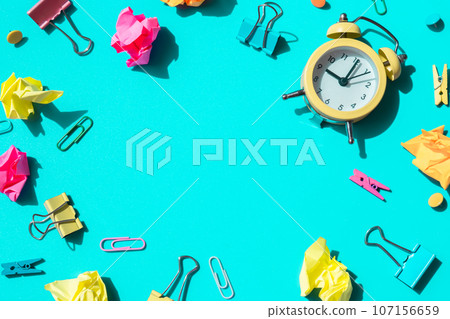 Frame border made of school stationery supplies and alarm clock. Copy space for your text or Educational greeting announcement for students and teacher. Creative vivid colorful background. Concept of 107156659