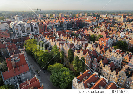 Beautiful panoramic architecture of old town in Gdansk, Poland at sunrise. Aerial view drone pov. Landscape cityscape City from Above. Small vintage historical buildings Europe Tourist Attractions 107156703