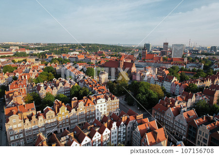Beautiful panoramic architecture of old town in Gdansk, Poland at sunrise. Aerial view drone pov. Landscape cityscape City from Above. Small vintage historical buildings Europe Tourist Attractions 107156708
