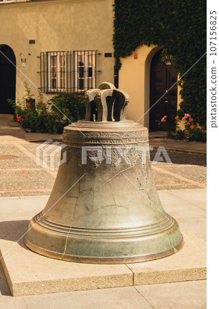 The Wishing Bronze bell in Kanonia Square in the old town of Warsaw, Poland Old town cracked bell from the cathedral now in town square The Wishing Bronze bell in Kanonia Square in the old town of Warsaw, Poland Old town cracked bell from the cathedral now in town square 107156825