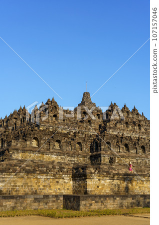 Female tourist walking in Borobudur temple (Java, Indonesia) 107157046