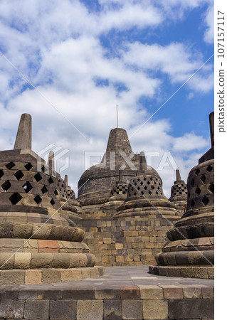 Borobudur temple stupa and blue sky (Java, Indonesia) 107157117
