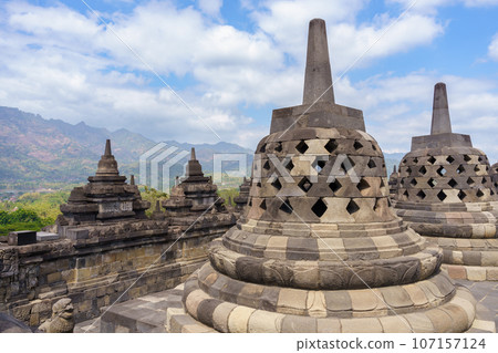 Borobudur temple stupa and blue sky (Java, Indonesia) Borobudur temple stupa and blue sky (Java, Indonesia) 107157124