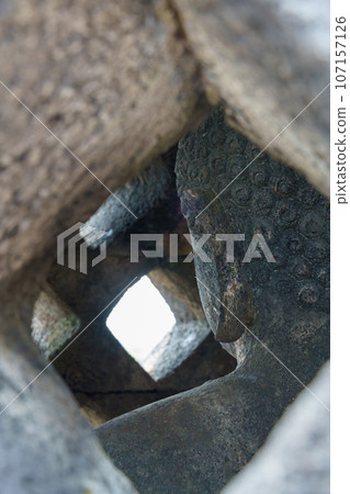 Buddha statue inside the stupa of Borobudur temple (Java, Indonesia) 107157126