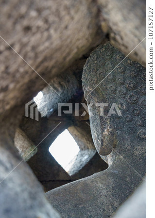 Buddha statue inside the stupa of Borobudur temple (Java, Indonesia) 107157127