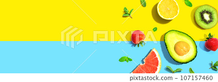 Avocado and mixed fruits overhead view 107157460