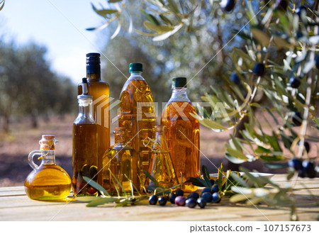 Olive oil in glass decanters and bottles Olive oil in glass decanters and bottles 107157673